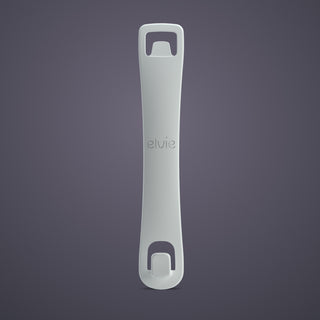Grey Elvie bra adjuster on a dark background