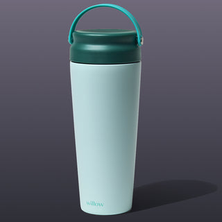 Teal breast milk cooler with handle on a white background