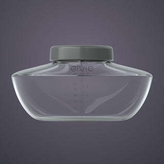 Clear breast pump bottle with a grey lid on a dark purple background