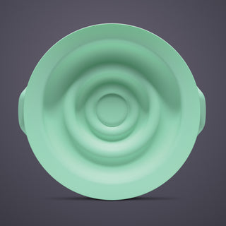 Green silicone seal for Elvie Pump on a dark grey background