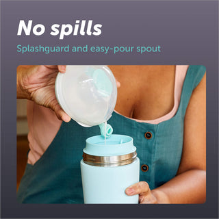 A woman pours breast milk from Elvie Wave manual breast pump in to Elvie Breast Milk Cooler