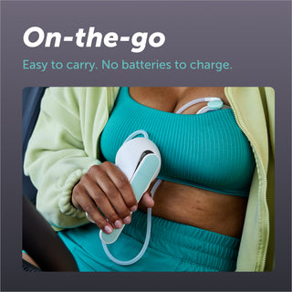 Person showcasing ease of use of elvie wave manual pump on the go