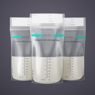 Three 100ml Elvie breast milk storage bags on a dark background