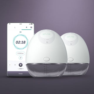 Double Elvie pump with a smartphone displaying a milk flow rate app on a dark background