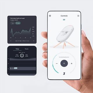 Hand holding a smartphone displaying an the Elvie Rise app with a white device on a gray background