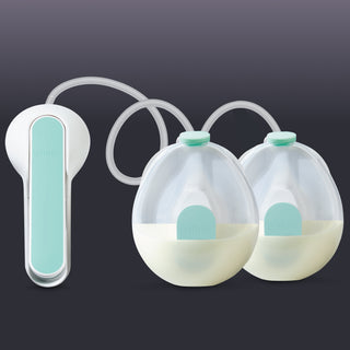 Elvie Wave manual pump with two collection cups and handle on a dark background