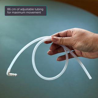 Hand holding adjustable Elvie Wave tubing with text on a blurred background