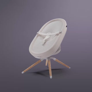 Elvie Rise smart bouncer transforming into bassinet mode on dark grey background